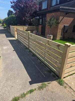 Horizontal slat front garden fence and gate by A Sterling Landscapes