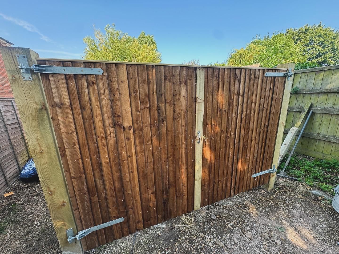 Bespoke timber driveway gate with galvanised hinges