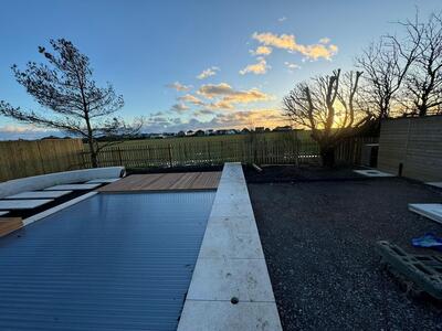 Swimming pool water feature by A Sterling Landscapes